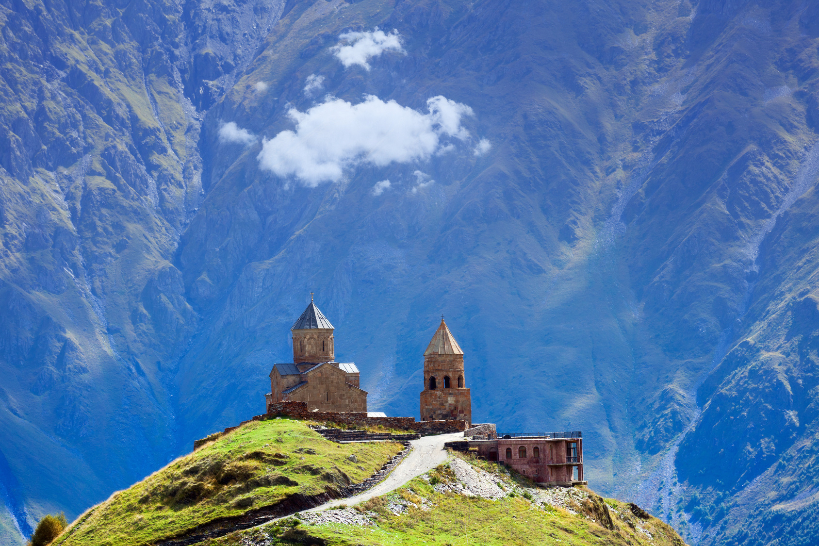 Gergeti Christian church near Kazbegi, Stepancminda village in Georgia, Caucasus