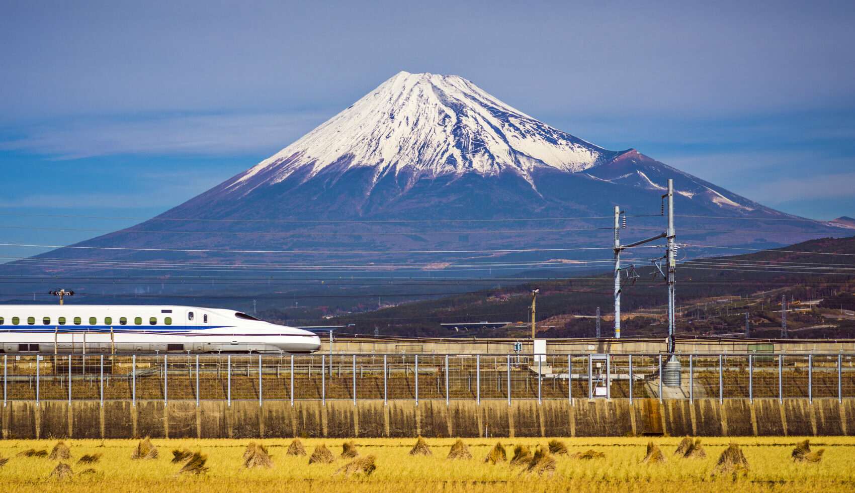 Bullet train passing Mount Fuji