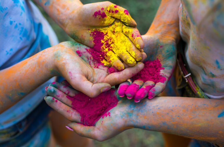 Children's hands covered in powder paint