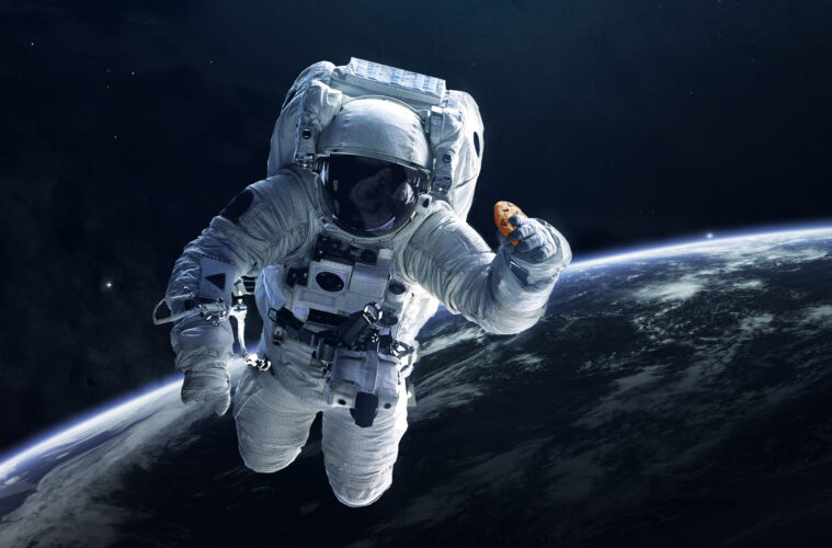 Astronaut holding Doubletree cookie