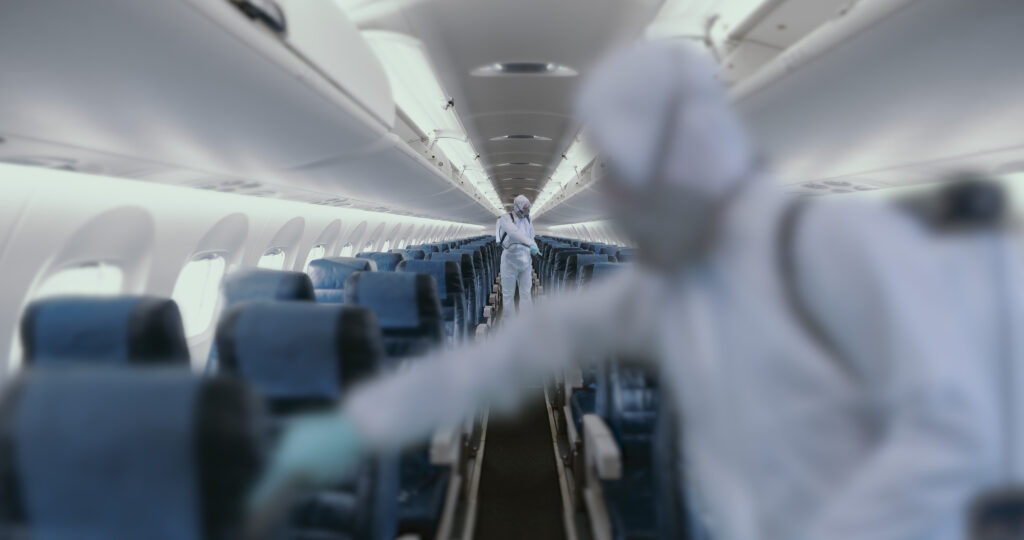 HazMat team decontaminating airplane cabin during virus outbreak