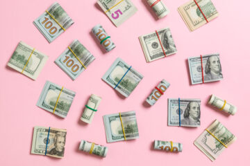 US dollars on a pink background