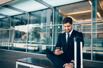 Businessman looking at smartphone