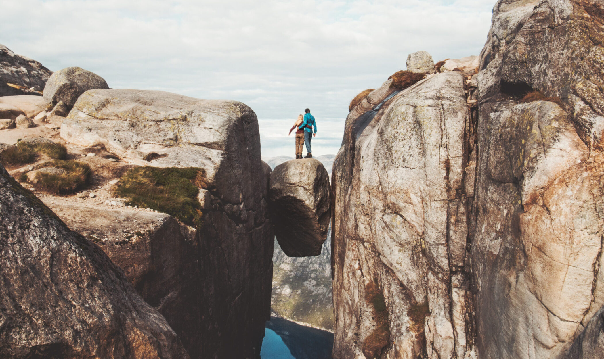 Travel couple on Kjeragbolten trip in Norway Kjerag
