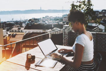Woman with laptop in Lisbon
