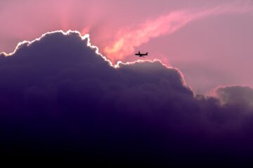 Plane in pink sky