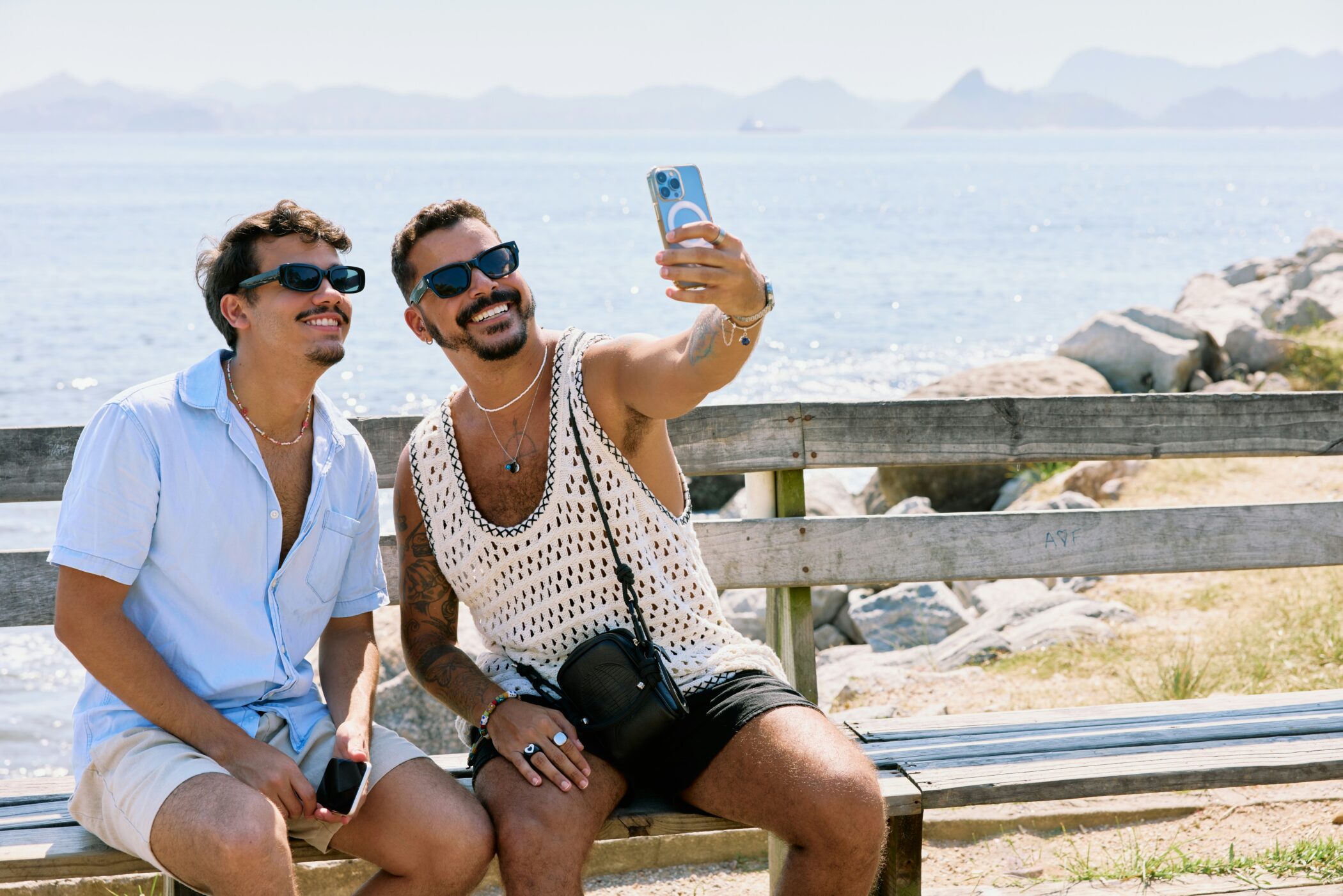 gay male couple by beach