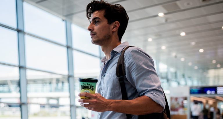 Jetlag Noodles AI rendering business traveller in airport